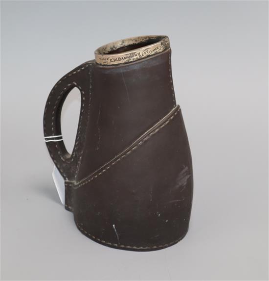 A Victorian silver mounted Lambeth faux leather jug, won by E.W. Backman 1894